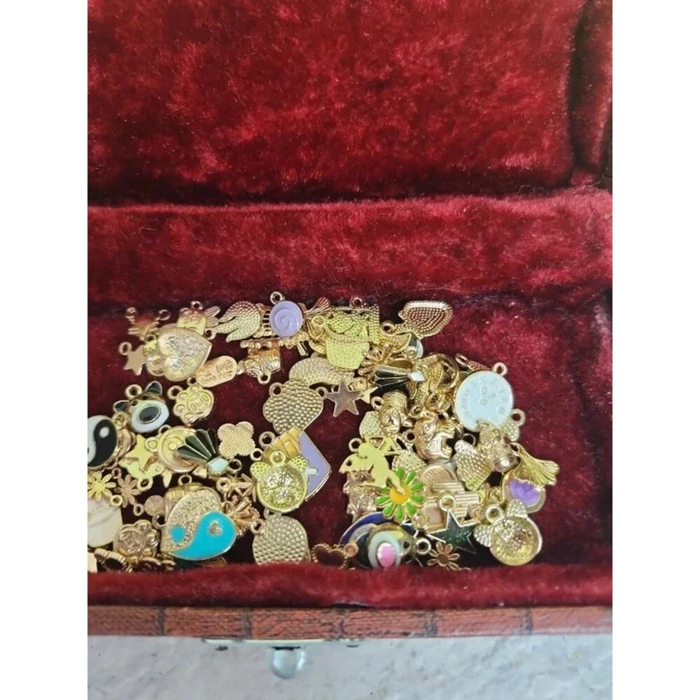 Faux alligator velvet lined box filled with charms